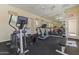 Well-equipped gym with modern equipment, including an elliptical and treadmill, plus large mirrors at 5450 E Mclellan Rd # 102, Mesa, AZ 85205