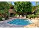 Relax in this serene in-ground jacuzzi surrounded by lush landscaping and palm trees, a true desert oasis at 5450 E Mclellan Rd # 102, Mesa, AZ 85205