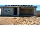 New home exterior shows an attached garage and the roof's clay tiling in the process of being installed at 5639 W Summerside Rd, Laveen, AZ 85339