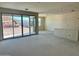 Large sliding glass doors offering seamless indoor/outdoor living in this spacious living room at 5639 W Summerside Rd, Laveen, AZ 85339