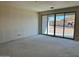 Large living area with sliding doors to backyard to be completed shows much promise at 5639 W Summerside Rd, Laveen, AZ 85339