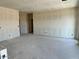 Unfinished living room featuring ample space, awaiting personalization and finishing touches at 5639 W Summerside Rd, Laveen, AZ 85339