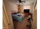 Bedroom with a blue bedspread, surfboard decor, and drum set at 5684 S 237Th Dr, Buckeye, AZ 85326