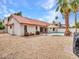 Rear exterior of home features a pool, open patio, and easy access to inside at 6704 W Topeka Dr, Glendale, AZ 85308