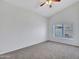 Bright bedroom with neutral carpet and a large window at 6704 W Topeka Dr, Glendale, AZ 85308