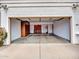 Spacious two-car garage featuring built-in storage cabinets and ample room for vehicles at 6704 W Topeka Dr, Glendale, AZ 85308