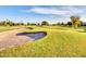 Scenic golf course featuring a sand trap and rolling green lawns under a bright sky at 6704 W Topeka Dr, Glendale, AZ 85308