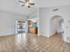 Open floor plan with tiled floors and a view into the kitchen at 6704 W Topeka Dr, Glendale, AZ 85308