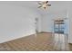Spacious living room with tiled floors and access to the backyard at 6704 W Topeka Dr, Glendale, AZ 85308