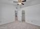 Bright main bedroom with carpet, features a walk-in closet, and access to other rooms at 6704 W Topeka Dr, Glendale, AZ 85308