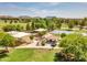 Scenic view of a community park featuring a playground, picnic gazebo, basketball court, and grassy areas at 6704 W Topeka Dr, Glendale, AZ 85308