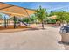 Spacious community playground with shade canopies, multiple play structures, and seating at 6704 W Topeka Dr, Glendale, AZ 85308