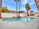 Inviting pool area features palm trees and white lounge chairs at 6704 W Topeka Dr, Glendale, AZ 85308