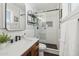 Beautiful bathroom with modern finishes, stylish vanity, glass enclosed shower, and black and white accents at 6926 E Culver St, Scottsdale, AZ 85257