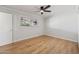Bright bedroom features hardwood floors, a window, neutral paint, and a ceiling fan at 6926 E Culver St, Scottsdale, AZ 85257