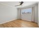 Bright bedroom with hardwood floors, neutral walls, and a window with curtains for a minimalist design at 6926 E Culver St, Scottsdale, AZ 85257