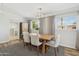 Elegant dining room featuring hardwood floors, stylish lighting, and designer furnishings at 6926 E Culver St, Scottsdale, AZ 85257
