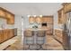 Open concept kitchen with a center island, stainless steel appliances, wood cabinets, and stylish pendant lighting at 6926 E Culver St, Scottsdale, AZ 85257