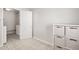 This mudroom offers built-in storage and decoratively tiled floors, leading to a bedroom with closet at 6926 E Culver St, Scottsdale, AZ 85257