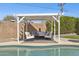 Relax in the shaded poolside lounge, featuring comfortable seating, perfect for enjoying the outdoors at 6926 E Culver St, Scottsdale, AZ 85257