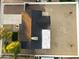 Birds eye view of renovated home with new roof, desert landscaping and perimeter fencing at 7316 W Carol Ave, Peoria, AZ 85345