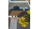 Aerial view of a single-story home with a dark roof and a landscaped front yard at 7316 W Carol Ave, Peoria, AZ 85345