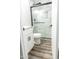 Remodeled bathroom featuring stylish shower, toilet, floors and updated vanity at 7316 W Carol Ave, Peoria, AZ 85345