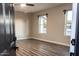 Neutral bedroom with vinyl wood floors and natural light coming through the windows at 7316 W Carol Ave, Peoria, AZ 85345