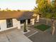 Charming single-story home with well-manicured landscaping, mature trees, and a white picket fence at 7316 W Carol Ave, Peoria, AZ 85345