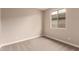 Neutral bedroom with window and carpeted floors at 7342 E Hackamore Ln, San Tan Valley, AZ 85143