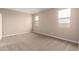 Vacant bedroom features neutral carpeting, baseboards, and two windows at 7342 E Hackamore Ln, San Tan Valley, AZ 85143