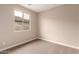 Neutral bedroom with window and carpeted floors at 7342 E Hackamore Ln, San Tan Valley, AZ 85143
