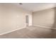Carpeted bedroom with a door opening to another room at 7342 E Hackamore Ln, San Tan Valley, AZ 85143