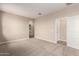 Spacious carpeted bedroom with ensuite bathroom and walk in closet at 7342 E Hackamore Ln, San Tan Valley, AZ 85143