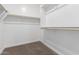 Walk-in closet with neutral carpet and shelving at 7342 E Hackamore Ln, San Tan Valley, AZ 85143