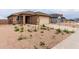 Charming single-story home featuring low-maintenance landscaping, a neutral color palette, and a two-car garage at 7342 E Hackamore Ln, San Tan Valley, AZ 85143