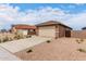 Charming single-story home featuring low-maintenance landscaping, a neutral color palette, and a two-car garage at 7342 E Hackamore Ln, San Tan Valley, AZ 85143