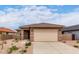 Charming single-story home featuring a neutral color palette, low-maintenance landscaping, and a two-car garage at 7342 E Hackamore Ln, San Tan Valley, AZ 85143