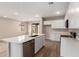 Modern kitchen features an island with stainless steel appliances and white cabinets at 7342 E Hackamore Ln, San Tan Valley, AZ 85143