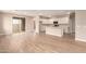 Open-concept living space featuring tile floors, a sliding glass door, and seamless flow into the kitchen at 7342 E Hackamore Ln, San Tan Valley, AZ 85143