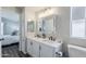 Bathroom featuring a double sink vanity with white countertops and cabinets, and toilet with modern fixtures at 7373 E Us Highway 60 -- # 108, Gold Canyon, AZ 85118