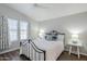 Bedroom with a ceiling fan, wood-look floors, white walls, and a black metal bed frame at 7373 E Us Highway 60 -- # 108, Gold Canyon, AZ 85118