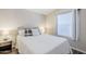 Bedroom featuring wood-look floors, a bed with a padded headboard, side table, and a window with blinds at 7373 E Us Highway 60 -- # 108, Gold Canyon, AZ 85118