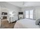 Bright bedroom with wood-look floors, white walls, ceiling fan and ensuite bathroom and sitting room access at 7373 E Us Highway 60 -- # 108, Gold Canyon, AZ 85118