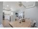 Open dining room with views of the kitchen, living area, and vaulted ceilings at 7373 E Us Highway 60 -- # 108, Gold Canyon, AZ 85118