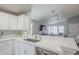Modern kitchen featuring stainless steel appliances, quartz countertops, and white cabinets at 7373 E Us Highway 60 -- # 108, Gold Canyon, AZ 85118