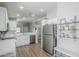 Modern kitchen with stainless steel appliances, quartz countertops, and white cabinets at 7373 E Us Highway 60 -- # 108, Gold Canyon, AZ 85118