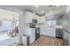 Modern kitchen with stainless steel appliances, white cabinets, and sleek countertops at 7373 E Us Highway 60 -- # 108, Gold Canyon, AZ 85118