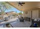 Relaxing covered patio area with desert landscaping, seating, and stylish outdoor decor at 7373 E Us Highway 60 -- # 108, Gold Canyon, AZ 85118