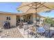 Charming brick patio featuring comfortable seating, a grill, and lush landscaping at 7373 E Us Highway 60 -- # 108, Gold Canyon, AZ 85118